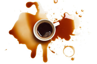 Black coffee with a spill