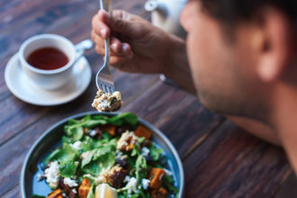 Man eating salad