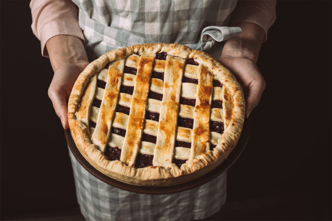 Woman holding a pie