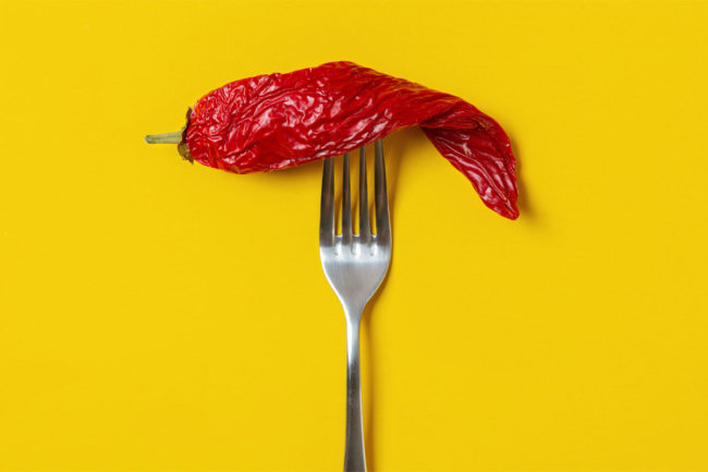 Dried red pepper on a fork