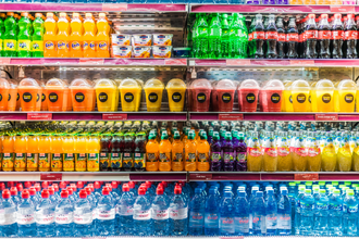 Bottles beverages on grocery store shelf